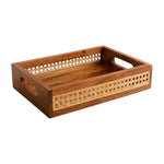 The Ellie Cane Tray by Be Home is a rectangular wooden serving tray featuring cutout handles and decorative woven cane panels on the sides, perfect for adding a touch of natural home decor to any space.
