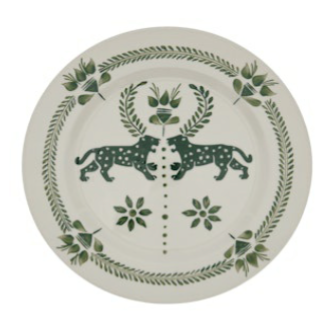 The Casa Dark Jungle Dinnerware Collection by Johanna Ortiz features a white plate with green designs of two leopards amid leaves and florals—ideal for mix-and-match tablescapes or as a standout, hand-painted ceramic piece.