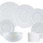 The Anna Weatherley Empire White Dinnerware Collection features fine white porcelain plates, bowl, and cup with a textured pattern, arranged against a plain background. Made in Portugal.