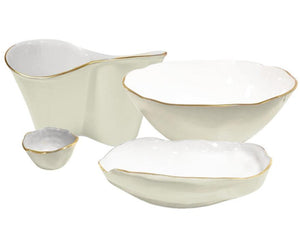 Four white ceramic dishes of varying sizes with irregular edges and gold trim are arranged together, showcasing the elegance of the Encanto Cream Serveware Collection by Beatriz Ball.