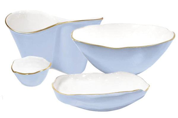 As a selection from the Beatriz Ball Encanto Periwinkle Collection, this set includes four ceramic serving dishes in light blue with white interiors and sophisticated gold rims. The set comprises a large bowl, a medium bowl, a small bowl, and an elongated dish.