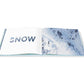 An open Escape travel photography book displays the word “SNOW” on the left page and an aerial photograph of a snowy mountain slope on the right.