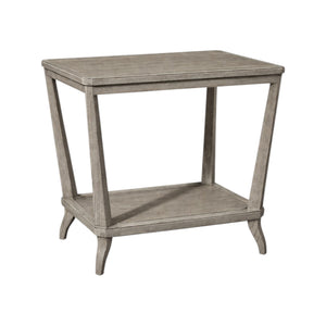 The Rye Rectangular Side Table by Hickory Chair features angled legs, an open lower shelf, and a weathered stone finish for a contemporary look.