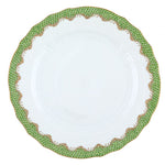 A white ceramic plate with textured edges from the Herend Fish Scale Evergreen Collection by Herend features an iconic green and gold pattern around the rim, reminiscent of their classic design.