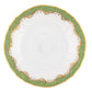 A hand-painted white porcelain plate with green and gold decorative patterns along the rim, scalloped edges, and part of the exquisite Herend Fish Scale Evergreen Collection by Herend.
