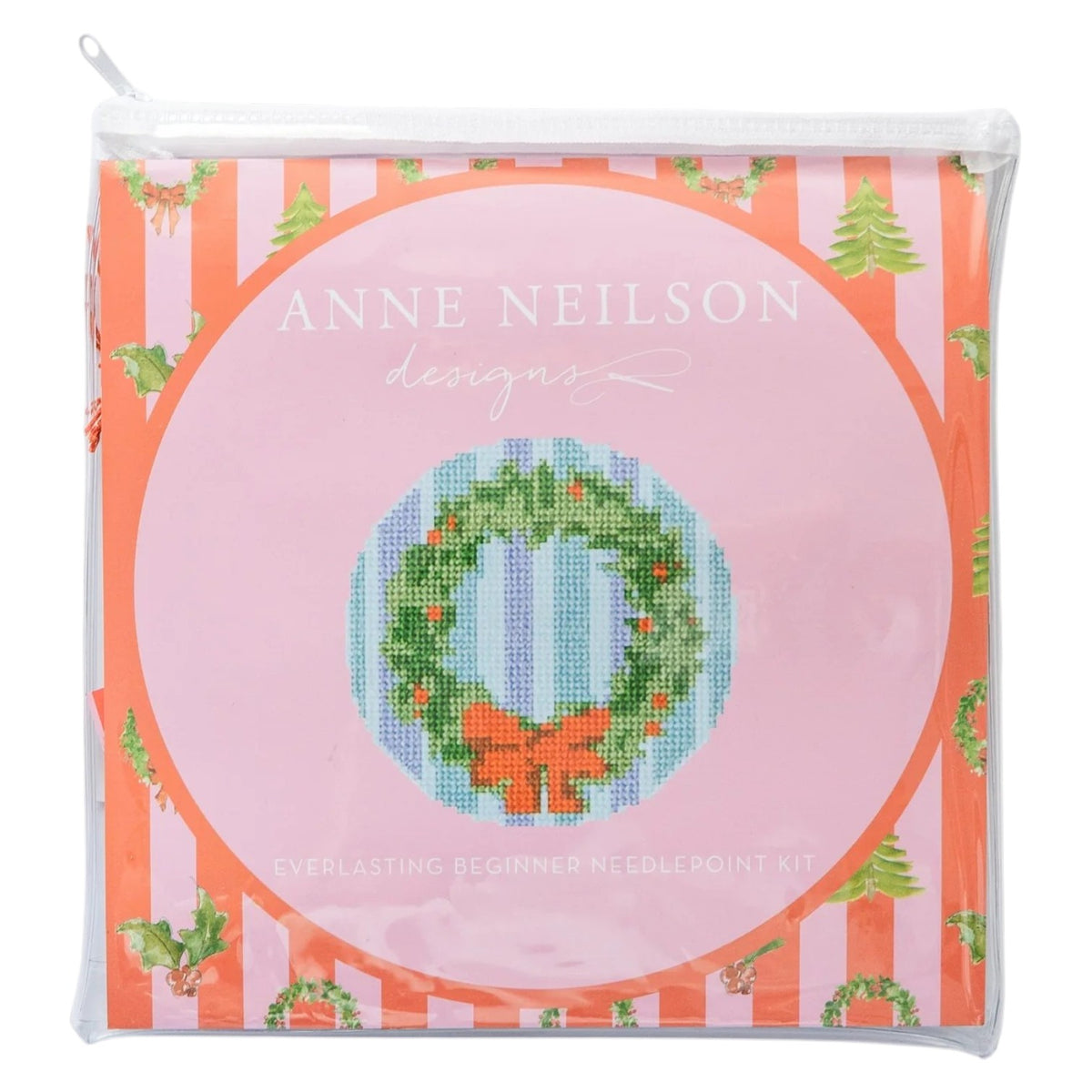 Anne Neilson Needlepoint Kits come in a clear pouch with a pink label, including beginner tools and a stitch-printed wreath canvas.