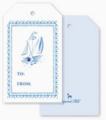 Two Dogwood-Hill Three Ships Sail Gift Tags: one featuring a blue watercolor sailboat illustration with “TO:” and “FROM:” lines, the other a plain light blue tag for gift wrapping.