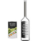 A Microplane Professional Series 2.0 extra coarse stainless steel grater with a black handle is displayed next to its packaging, which features vegetables and the product name.