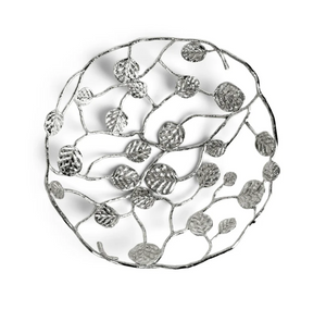 The Michael Aram Botanical Leaf Bread Basket is a round, silver decorative piece with an openwork branch, leaf, and foliage design from the Botanical Leaf Collection.