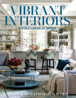 Book cover for “Vibrant Interiors” by Common Ground features a stylish living room with modern furnishings, a bar area, glass decor, and an arrangement of flowers on a coffee table.