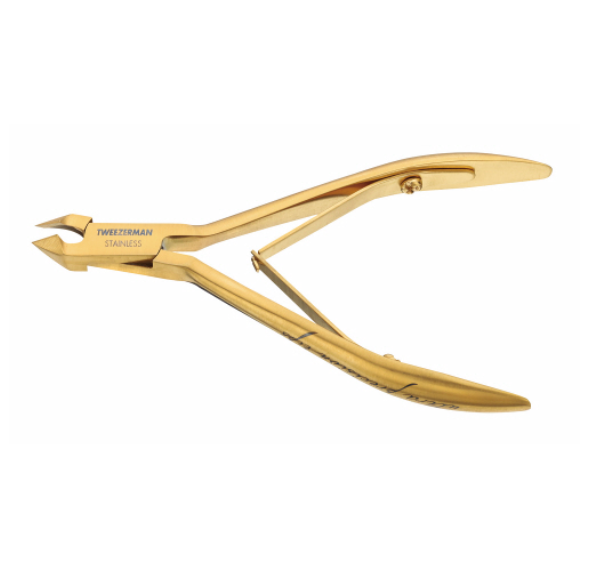 The Tweezerman Ultra Precision Gold Cuticle Nipper, crafted from stainless steel with a spring handle, is shown against a white background for precision cuticle care.