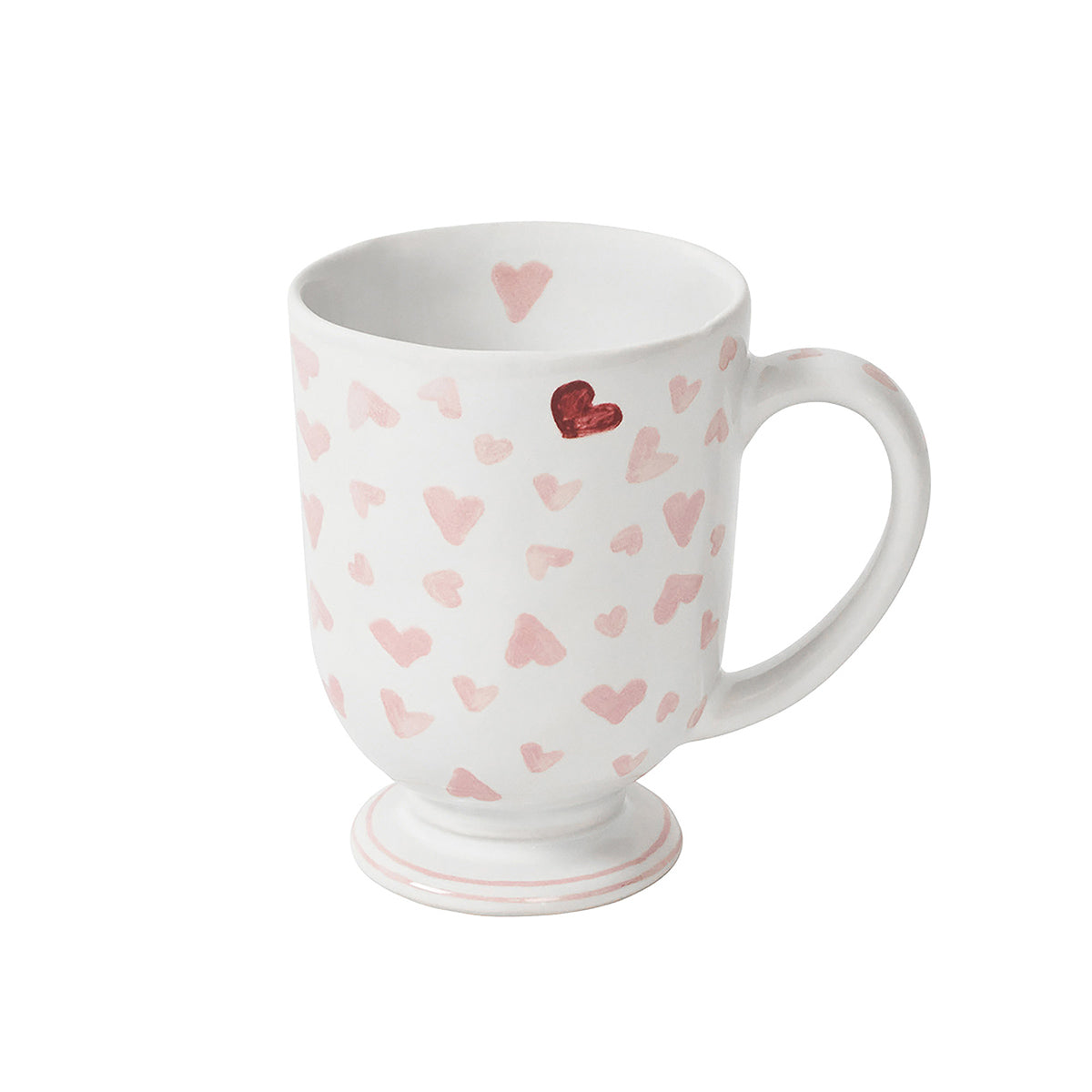 This white ceramic mug from Juliska’s Love You More Decor and Tabletop Collection features pink and red hearts with a pedestal base—ideal to match with pink heart plates or other sweet tableware for a charming, love-themed setting.