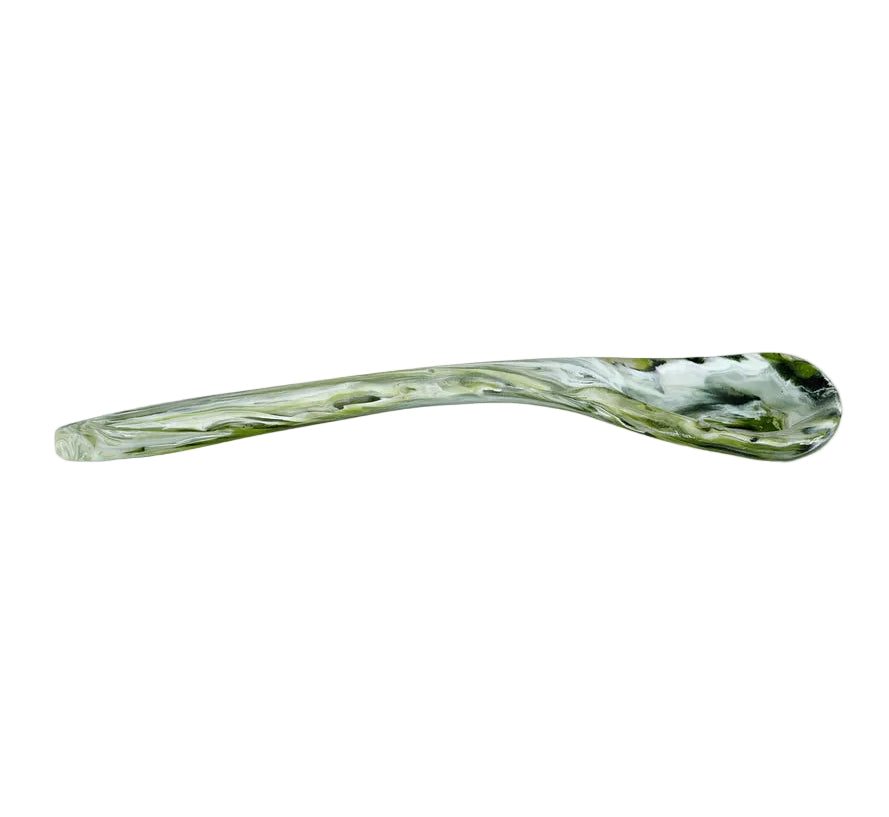 The Nashi Home Serveware Collection, Forest, features a curved glass spoon with a marbled green and white pattern—an eye-catching accent for serving or decor from Nashi Home, shown side view on a white background.