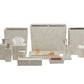 The Ghent Bath Collection by Pigeon & Poodle features beige bathroom accessories—woven grass tissue box, dispensers, trays, waste bins, toothbrush holder, soap dish, and cotton jar—shown beautifully on a white background.