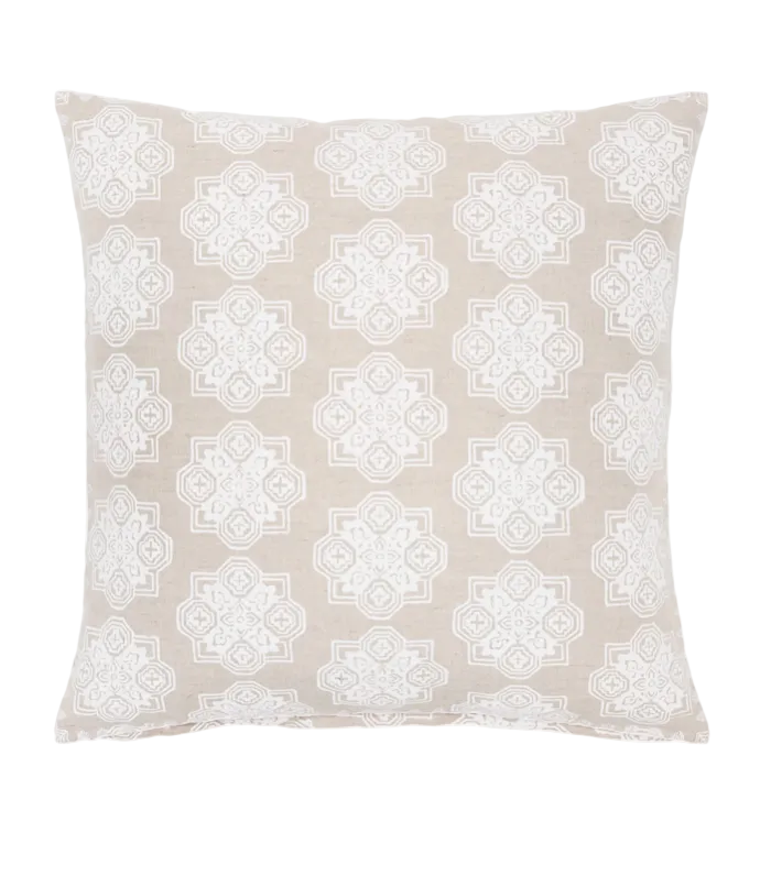 Square John Robshaw Raahi throw pillow in light beige with a repeating white geometric hand block printed motif.