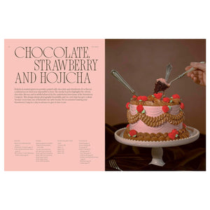 A pink Fancy Cakes cake featuring Baroque buttercream roses and leaves, with a hand lifting a slice on a silver fork next to the ingredient list for a chocolate, strawberry, and hojicha recipe.