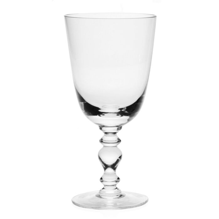 A clear, empty wine glass from the William Yeoward Crystal Fanny Clear Collection with a sculpted stem and classic bowl stands elegantly against a plain white background.