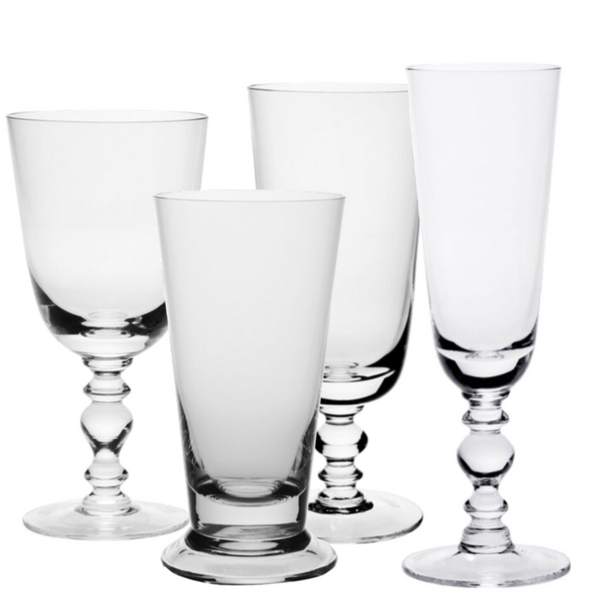 Five variously shaped empty William Yeoward Crystal Fanny Clear Collection glass goblets, including champagne flutes and wine glasses, on a white background.