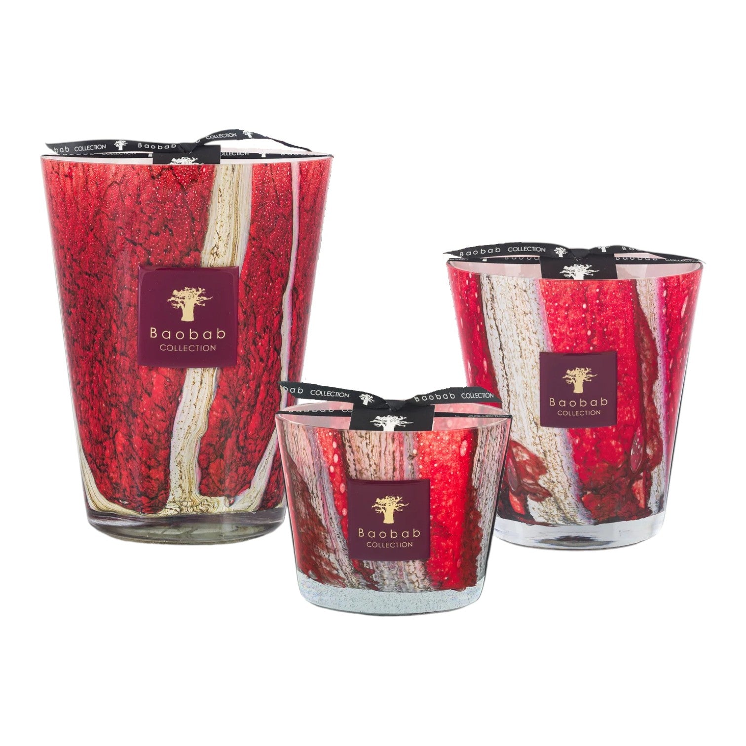 The Baobab Collection Woods Risoud Candle by Baobab features festive red and white stripes, with a scent inspired by the peaceful Swiss forest.