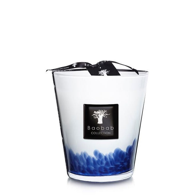 A Baobab Collection Feathers Touareg candle in a glass container with a blue gradient design, tied with a black ribbon.