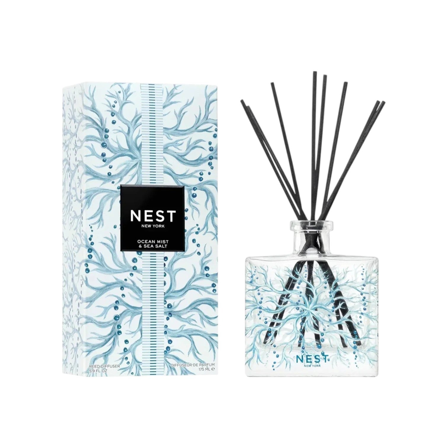 The Nest Ocean Mist & Sea Salt Candle Collection, in a blue and white coral-designed box, fills your home with a refreshing ocean mist and sea salt scent—an ideal addition to any candle collection.