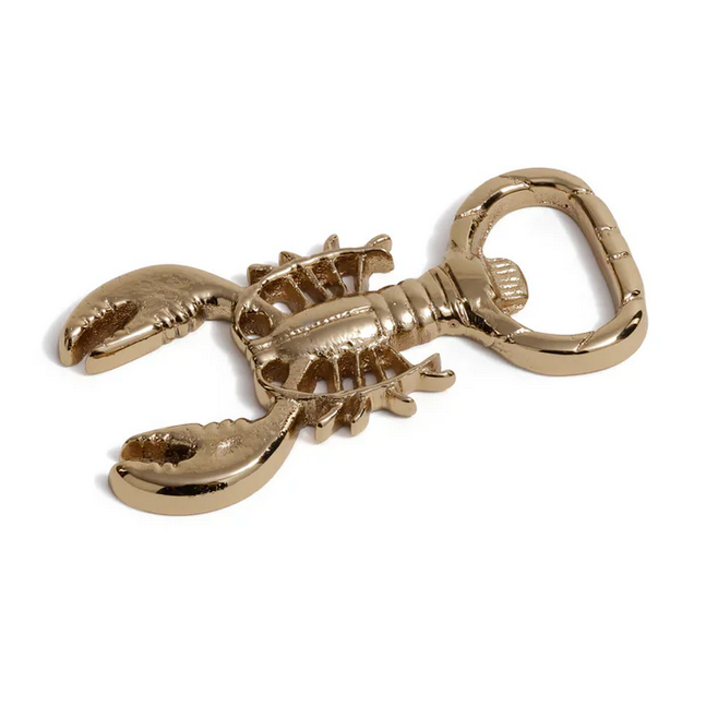 The Zodax Lobster Bottle Opener in Polished Gold features detailed claws, legs, and tail, adding a stylish coastal accent to your barware collection.