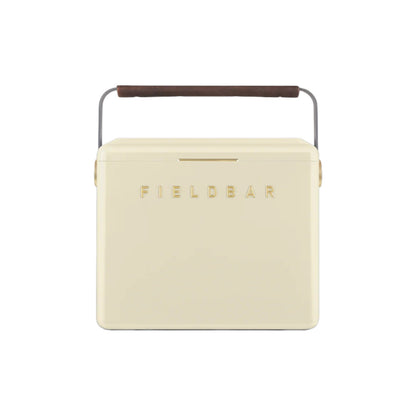 The Fieldbar Gin Trunk is a cream-colored hard case cooler with a dark brown handle and "FIELD BAR" embossed on the front, delivering superior thermal performance for all your outdoor adventures.