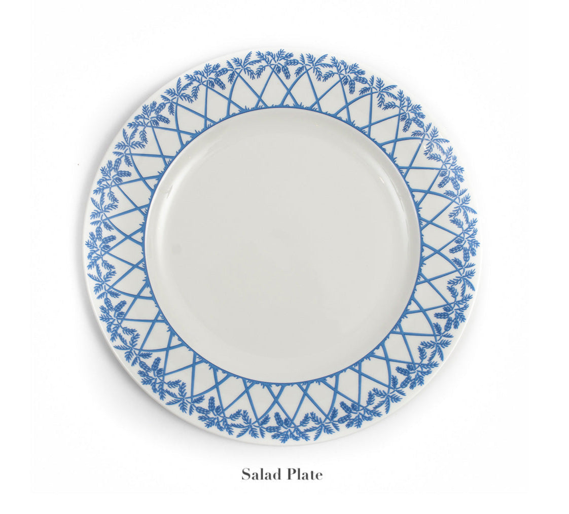 The Azure Blue Dinnerware Collection by Pink House Mustique features a round white salad plate in fine bone china with a blue geometric and floral border, shown from above on a plain white background.