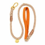 The Found My Animal Waxed Cotton Canvas Leash Collection features a handcrafted rope dog leash with gold hardware, an orange waxed canvas handle, and a round gold tag engraved with "FOUND 11796.