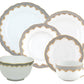 A set from the Herend Fish Scale Gray Collection by Herend, featuring plates, a bowl, and a teacup with matching saucer. Each piece boasts an elegant patterned rim adorned with gold and blue accents, highlighted by hand-painted designs that elevate artistic appreciation.