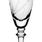 A clear glass champagne flute from the William Yeoward Crystal Palmyra Collection, featuring an etched design of palm trees on the bowl that evokes the pristine coral reefs of Palmyra Atoll.