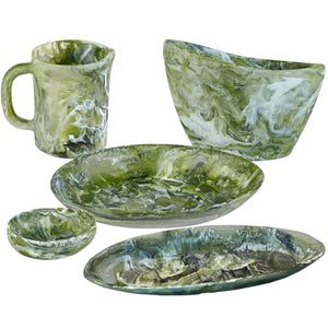 The Nashi Home Serveware Collection, Forest by Nashi Home includes a mug, bowl, small dish, round plate, and oval plate in green and white marbled resin—ideal as stylish serveware or a chic home decor accent.