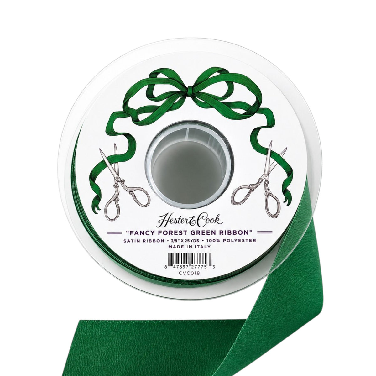 A spool of Fancy Ribbon by Hester & Cook in rich green satin—ideal for gift wrapping—features a label adorned with scissors and a bow. The text on the label reads: “Fancy Ribbon, Hester & Cook. 1.25″ x 25 yds, 100% Polyester, Made in Italy.” Add an elegant touch to your presents with this luxurious satin ribbon.