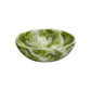 The Nashi Home Serveware Collection, Forest, features a round BPA-free resinware bowl with a green and white marbled pattern inside and out.