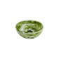 The Nashi Home Serveware Collection, Forest, features a round BPA-free resin bowl with a green and white marbled pattern by Nashi Home, shown on a plain white background—perfect for adding style to any table setting.