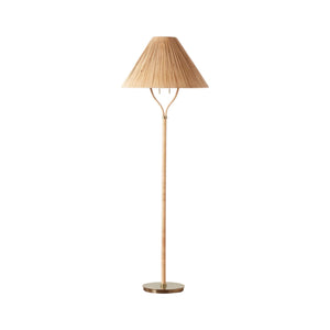 The Delphine Floor Lamp by Selamat features a handcrafted pleated rattan cone shade, a slender wooden stand, and a round brass base with elegant brass accents, shown against a white background.