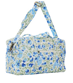 John Robshaw Aadav Quilted Bag featuring a blue and green floral print, an adjustable shoulder strap, and an exterior zippered pocket.