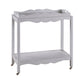The Lawson Bar Cart by Branch Home features two white wooden tiers with scalloped edges, a magnetic tray, and four small caster wheels—perfect for serving drinks.