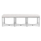 The Made Goods Lex Bench features an upholstered white cushioned seat atop a geometric chrome metal base, presenting modern elegance when viewed from the front against a white background.