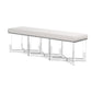 The Lex Bench by Made Goods features a long, rectangular design with an upholstered white cushioned seat and clear acrylic legs. Its modern geometric base adds a touch of elegance to any space.