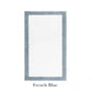 The Egoist Border Bath Rug by Graccioza features a white center with a French blue border and is crafted from luxurious Egyptian cotton. Displayed on a white background with "French Blue" text below the rug.