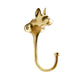 The Rejuvenation Cast Brass Dog Hooks feature a whimsical dog's head design in gold metal with a long, curved shape for hanging items.