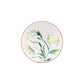 The Florenza Impero Dinnerware Collection by Ginori 1735 features a round white plate with a pink rim and a central painted design of green leaves and yellow flowers—an elegant piece in fine Italian porcelain.