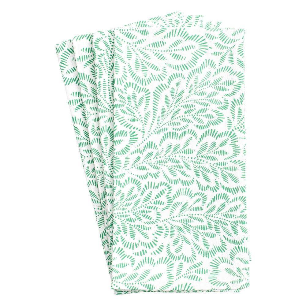Handcrafted from cotton, Caspari’s Block Print Leaves Napkin Collection features a green leafy pattern on white, celebrating the elegance of Indian textiles.
