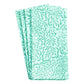 Caspari’s Block Print Leaves Napkin Collection includes three folded cotton napkins featuring a green leafy pattern on white, inspired by traditional Indian textiles.