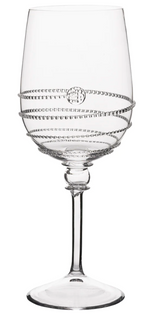 A clear wine glass from the Juliska Amalia Drinkware Collection features a decorative spiral pattern, a small circular motif on the bowl, and intricate details on its thin stem and round base.