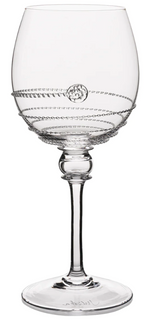 The Amalia Drinkware Collection by Juliska features clear wine glasses with intricate silver wire details and a round silver accent, highlighting the artistry behind each piece.