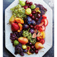 A white platter overflowing with an assortment of fresh fruits—such as grapes, figs, cherries, pears, plums, and apricots—artfully arranged in a vibrant, tapas-style grazing presentation inspired by Graze from Penguin Random House.