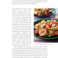 A cookbook page from Go-to Dinners by Penguin Random House features text about meal planning during the pandemic and a photo of a salad with shrimp, vegetables, and greens on a white plate. Inspired by Ina Garten recipes, the content provides easy dinner ideas and comforting recipes designed to help navigate uncertain times.