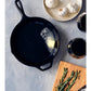 The Couple’s Cookbook from Penguin Random House sets the scene for shared culinary adventures: A cast iron skillet melts a pat of butter, while nearby a wooden board with rosemary, a plate of garlic bulbs, and two cups of dark liquid invite couples to cook and savor delicious moments together.